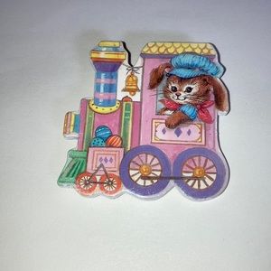 Z174-Costume jewelry- Easter themed brooch that is a bunny driving’s a train.
